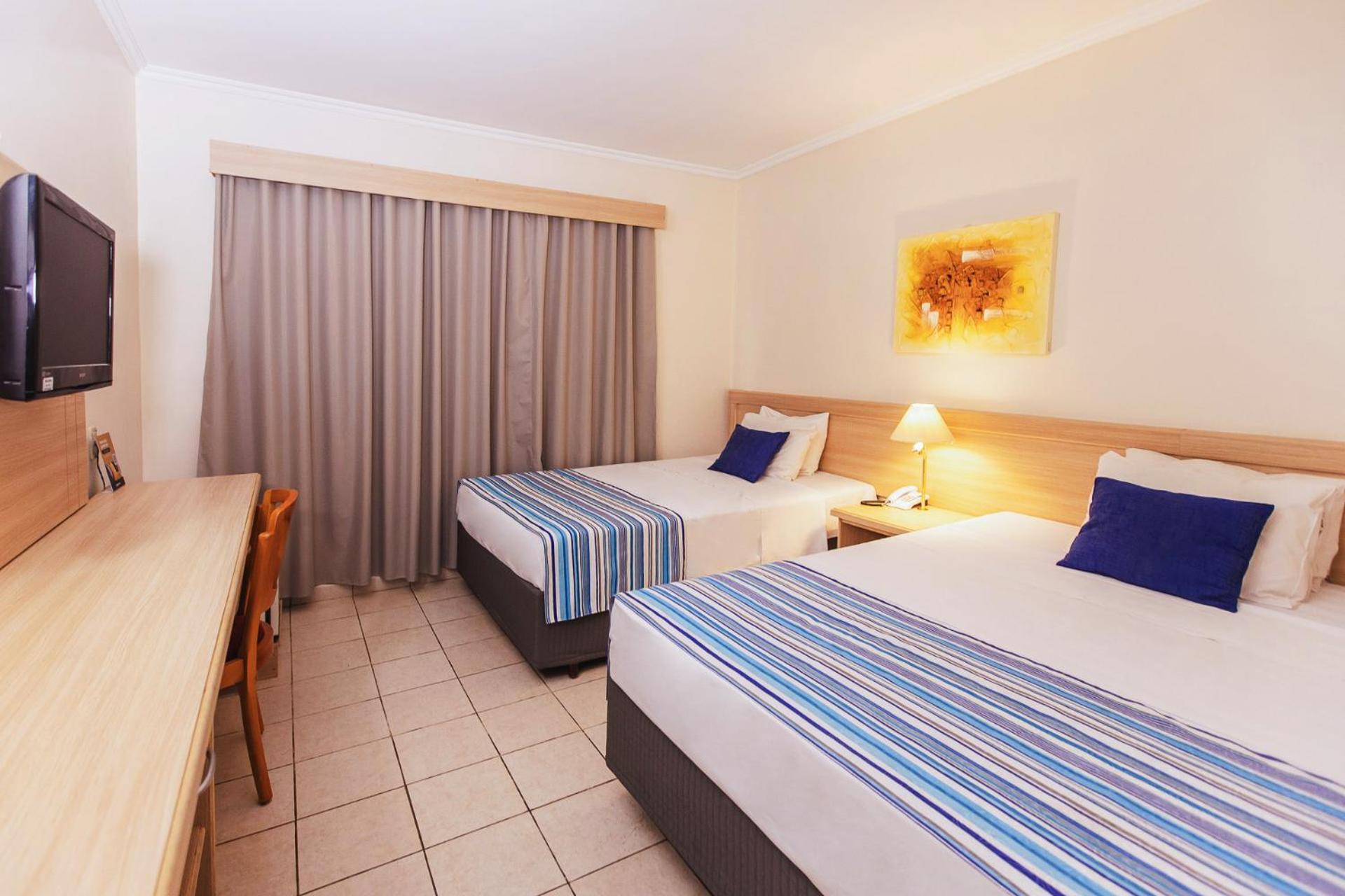 Quarto Triplo Executivo